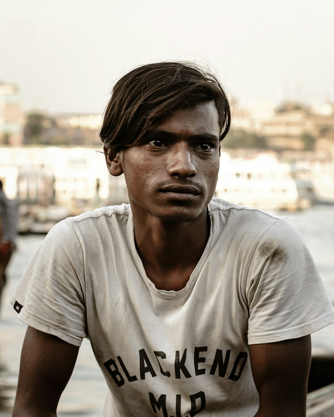 Portrait of a man in a shirt looking at the camera